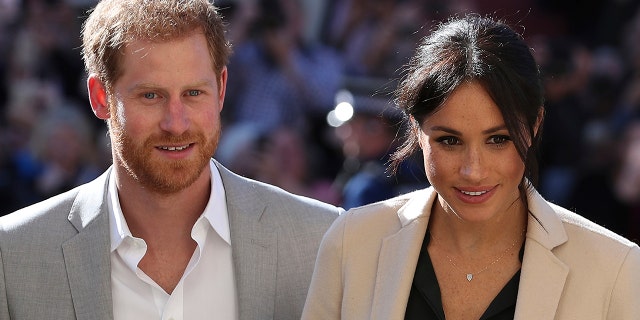 Britain's Prince Harry and Meghan, the Duchess of Sussex greet well-wishers during their visit to Chichester, southeast England, Oct. 3, 2018.