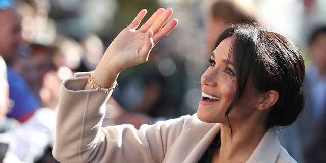 Britain's Meghan, the Duchess of Sussex greets well wishers as she and Prince Harry visit Chichester, south east England, Wednesday Oct. 3, 2018. The Duke and Duchess of Sussex made their first joint official visit to Sussex.