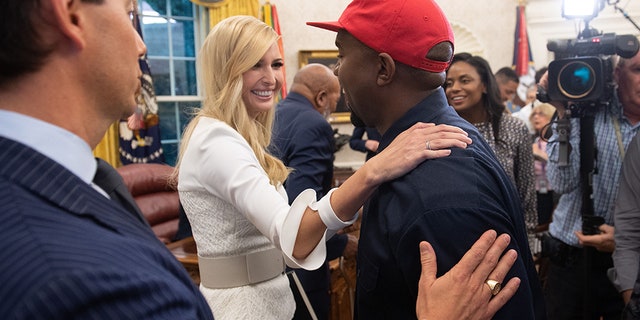 Rapper Kanye West speaks with Ivanka Trump after meeting with US President Donald Trump in the Oval Office of the White House in Washington, DC, on October 11, 2018.