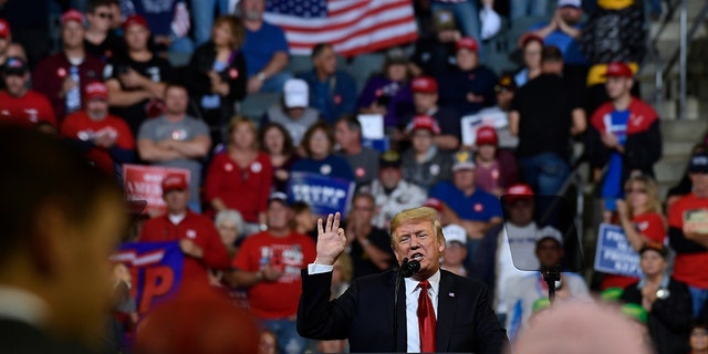 President Trump speaks at a rally in Council Bluffs, Iowa, Tuesday, Oct. 9, 2018.