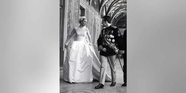 Princess Grace Kelly with Rainier III, Prince of Monaco on their wedding day.