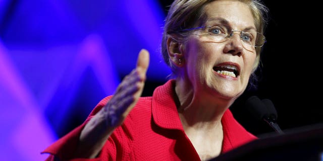 FILE - In this June 1, 2018 file photo, Sen. Elizabeth Warren, D-Mass., speaks at the 2018 Massachusetts Democratic Party Convention in Worcester, Mass. Â Warren has released results of a DNA test showing Native American ancestry in an effort to diffuse the issue ahead of any presidential run. (AP Photo/Elise Amendola)