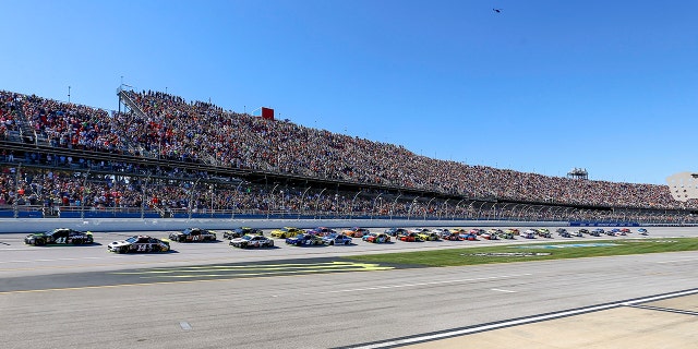 FILE - Kurt Busch (41) leads the pack to the start/finish line for the green flag in the 1000Bulbs.com 500 NASCAR Cup Series auto race at Talladega Superspeedway, Sunday, Oct. 14, 2018, in Talladega, Ala.