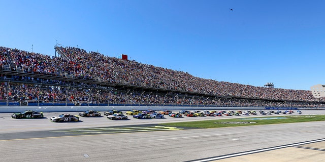 FILE - Kurt Busch (41) leads the pack to the start/finish line for the green flag in the 1000Bulbs.com 500 NASCAR Cup Series auto race at Talladega Superspeedway, Sunday, Oct. 14, 2018, in Talladega, Ala.