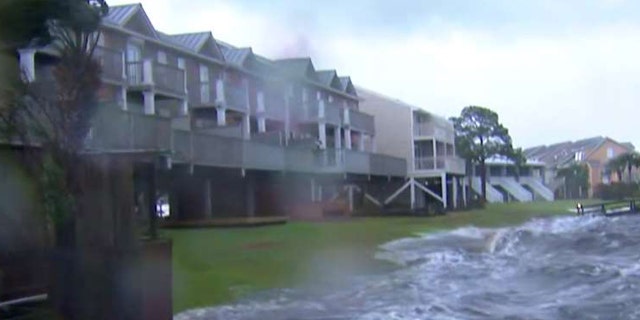 Parts of the Florida Panhandle could see between 9 and 13 feet of storm surge. Water was already rising in Alligator Point, Fla. on Wednesday ahead of Hurricane Michael's arrival.