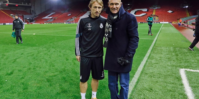 Terry Nelson poses with Real Madrid soccer star Luka Modric; Madrid are one of the European soccer teams who have used the suits