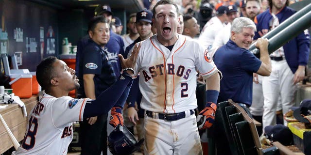 Houston Astros' Alex Bregman (2) celebrates after hitting a solo home run against Cleveland Indians pitcher Trevor Bauer during the seventh inning of Game 2 of the American League Division Series, in Houston, Oct. 6, 2018.