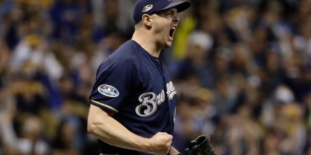 Milwaukee Brewers relief pitcher Corey Knebel reacts after getting Los Angeles Dodgers' Justin Turner to strike out to end Game 1 of the baseball National League Championship Series on Friday, Oct. 12, 2018, in Milwaukee. The Brewers won 6-5 to take a 1-0 lead in the series.