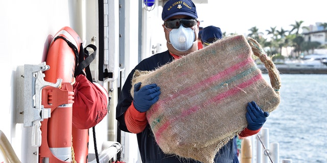 Photos provided by the Coast Guard showed “bales of cocaine” as they were being unloaded from the vessel.