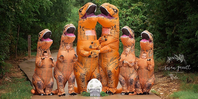 In the hilarious pregnancy announcement, Nicole and Daniel Berkley of Aubrey dressed up along with their kids - Myleigh, 10, Montana, 6, Lane, 5 and Hannah, 4 – in matching oversized, prehistoric reptile outfits for a memorable photoshoot.