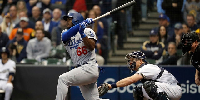 Los Angeles Dodgers slugger Yasiel Puig defected from Cuba in 2012. (AP Photo/Jeff Roberson)