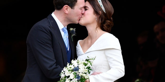 Princess Eugenie and Jack Brooksbank kiss after their wedding.