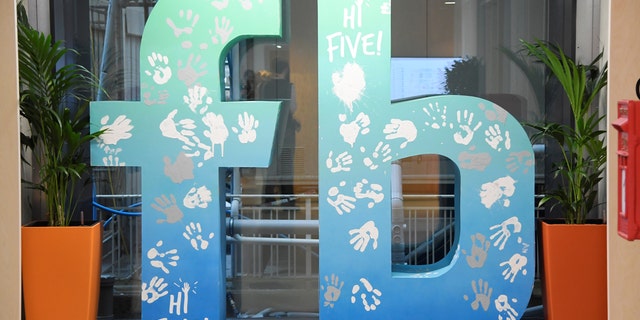 A large logo is seen at Facebook's headquarters in London, Britain. (REUTERS/Toby Melville)