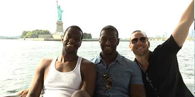 Tallahassee, Fla. Mayor Andrew Gillum, center, poses with brother Marcus Gillum, left, and lobbyist Adam Corey during a boat cruise in New York Harbor in August of 2016. (Courtesy Christopher Kise)