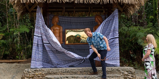 Prince Harry, Duke of Sussex, unveils a plaque during a dedication of the Colo-i-Suva forest to the Queen's Commonwealth Canopy in Suva, Fiji, on Wednesday, Oct. 24, 2018.
