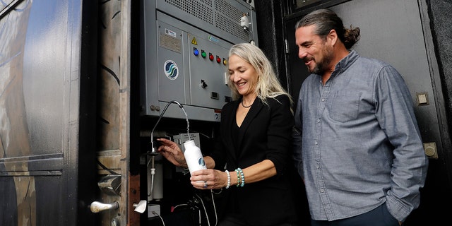 The Skysource/Skywater Alliance co-founders David Hertz, right, and his wife Laura Doss-Hertz demonstrate how the Skywater 300 works Wednesday in Los Angeles.