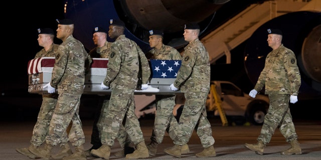 A U.S. Army carry team transferred the remains of Sgt. James Slape of Morehead City, N.C., at Dover Air Force Base in Delaware on Saturday.