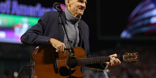 James Taylor sings the national anthem during Game 1 of the 2018 World Series between the Los Angeles Dodgers and Boston Red Sox at Fenway Park on October 23, 2018 in Boston, Massachusetts.