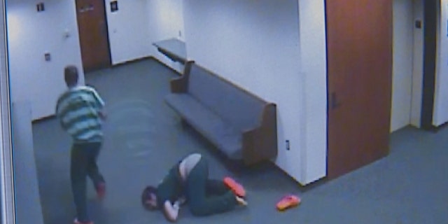 Kodey Howard can be seen falling on his face and losing a shoe as he attempted to follow Tanner Jacobson when they bolted from the courtroom.
