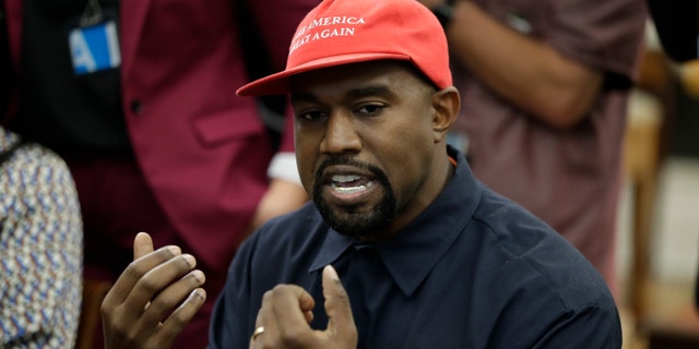 Rapper Kanye West speaks to President Donald Trump and others in the Oval Office of the White House, Thursday, Oct. 11, 2018, in Washington.