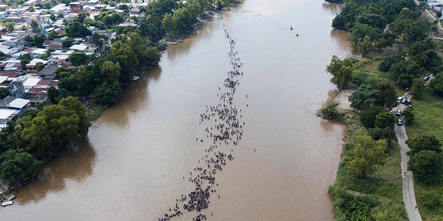 A group of Central American migrants bound for the US border has flown through the Suchiate River, which connects Guatemala and Mexico, to Tecun Uman, Guatemala.