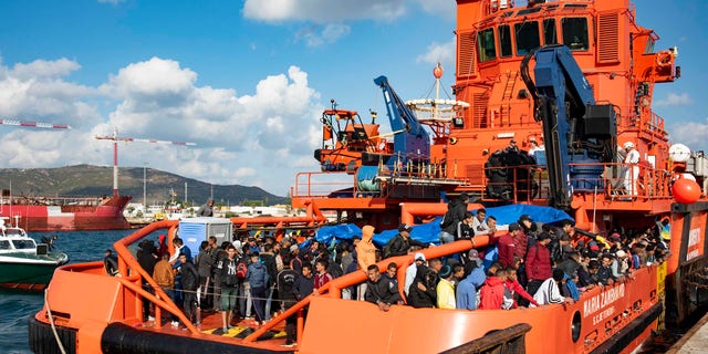 In this photo taken on Saturday, Oct. 27, 2018, migrants arrive at the port of San Roque, southern Spain, after being rescued by Spain's Maritime Rescue Service in the Strait of Gibraltar.