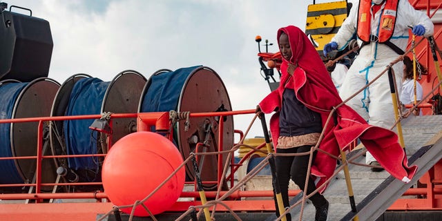In this photo taken on Saturday, Oct. 27, 2018, migrants arrive at the port of San Roque, southern Spain, after being rescued by Spain's Maritime Rescue Service in the Strait of Gibraltar.