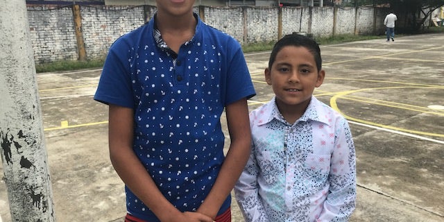 Coscuez locals Edison, 12 and Daniel, 8 ahead of English languages lessons.