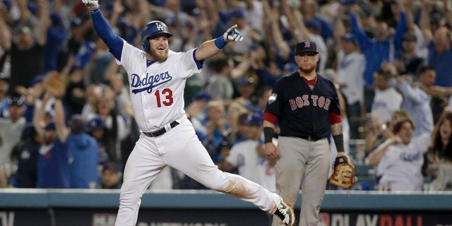 Los Angeles Dodgers' Max Muncy celebrates after his walk-off home run against the Boston Red Sox in the 18th inning of Game 3 of the World Series, on Saturday, Oct. 27, 2018, in Los Angeles. (Associated Press)