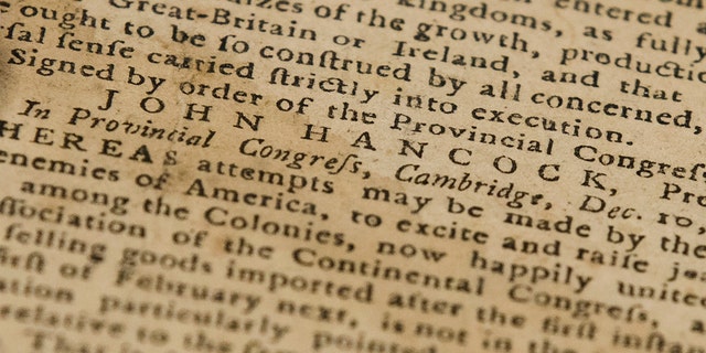 This Thursday photo shows John Hancock's name in a Dec. 28, 1774, Pennsylvania Journal and the Weekly Advertiser at the Goodwill in Bellmawr, N.J.