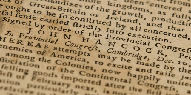 This Thursday photo shows John Hancock's name in a Dec. 28, 1774, Pennsylvania Journal and the Weekly Advertiser at the Goodwill in Bellmawr, N.J.