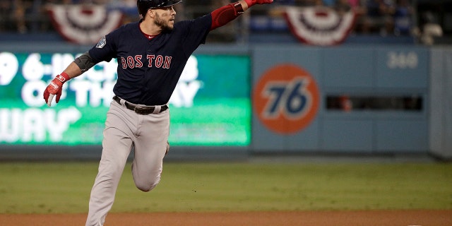Boston Red Sox's Steve Pearce celebrates after his home run against the Los Angeles Dodgers during the eighth inning in Game 4 of the World Series baseball game on Saturday, Oct. 27, 2018, in Los Angeles. (Associated Press)
