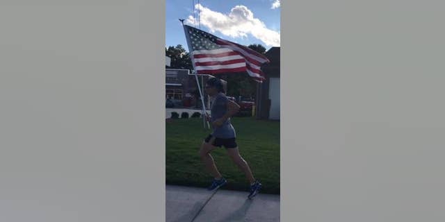 Parfitt said his favorite aspect of running with the flag is holding it "high and proud."