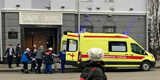 An ambulance carries a casualty after an explosion at the entrance of an FSB office in the city of Akhangelsk, in northern Russia.