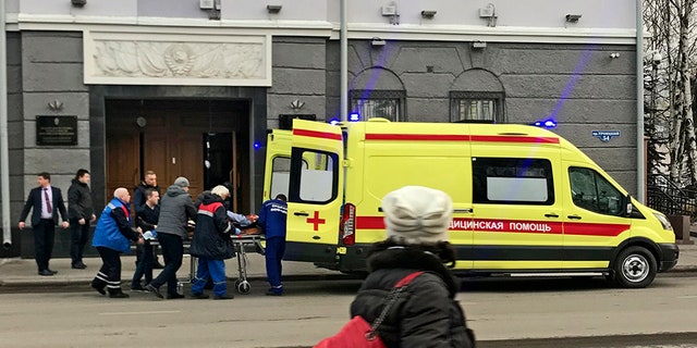 An ambulance carries a casualty after an explosion at the entrance of an FSB office in the city of Akhangelsk, in northern Russia.