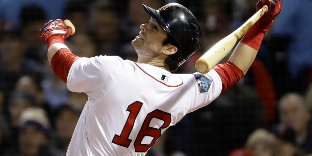 Boston Red Sox's Andrew Benintendi hits a single during the third inning of Game 1 of the World Series baseball game against the Los Angeles Dodgers on Tuesday in Boston.