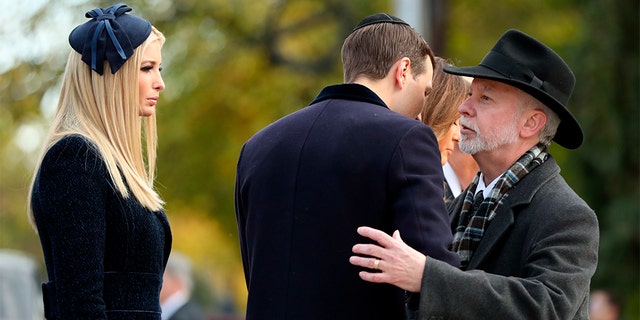 Jared Kushner, center, and Ivanka Trump, left, greet Tree of Life Rabbi Jeffrey Myers, right, as they arrive with President Donald Trump and first lady Melania Trump outside Pittsburgh's Tree of Life Synagogue in Pittsburgh, Tuesday, Oct. 30, 2018. (AP Photo/Andrew Harnik)