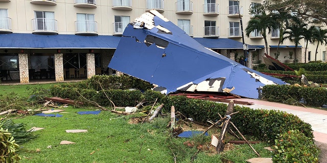 Residents of the U.S. territory braced Thursday for months without electricity or running water after the islands were slammed with the strongest storm to hit any part of the U.S. this year. (AP Photo/Dean Sensui)