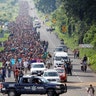 Central American migrants walk along a highway near the Mexican border with Guatemala, as they continue their journey to the United States, in Tapachula, Mexico, on Oct. 21, 2018. 