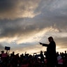 President Donald Trump arrives as the sun sets to speak at a campaign rally at Minuteman Aviation Hangar, in Missoula, Montana, Oct. 18, 2018.