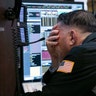 Trader Jonathan Mueller works in his booth on the floor of the New York Stock Exchange, Oct. 26, 2018.  