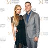 Paris Hilton played it coy alongside fiancé Chris Zylka at the VIP opening of Maddox Gallery LA in West Hollywood, Calif. on October 11, 2018.