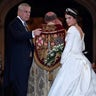 Britain's Princess Eugenie enters St George's Chapel with her father Prince Andrew, Duke of York, for her wedding to Jack Brooksbank in Windsor Castle, Windsor, Britain October 12, 2018. REUTERS/Toby Melville - RC11C0AD5490