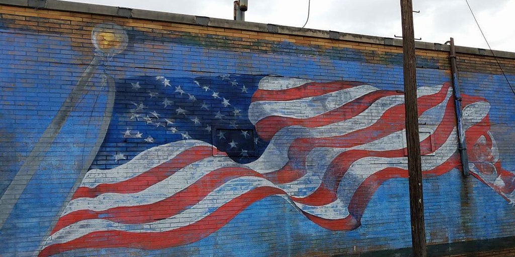 American flag mural at pizza shop vandalized, protested in small