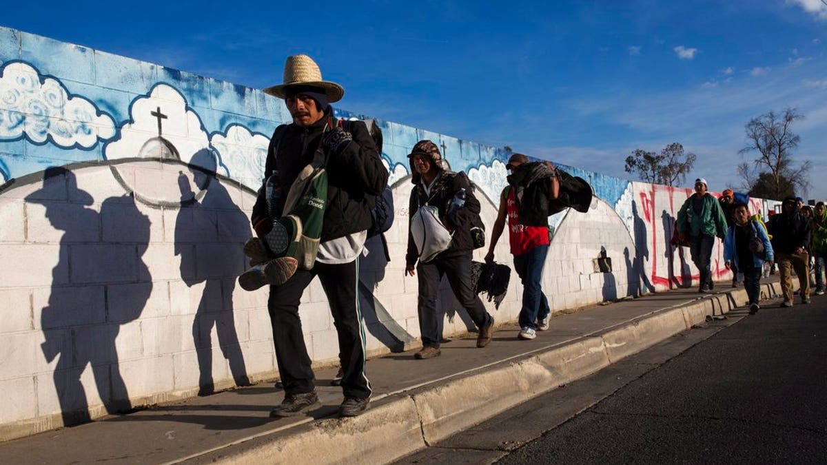 Migrants, who are part of a Central American migrant caravan, leave Mexicali for Tijuana, Mexico.