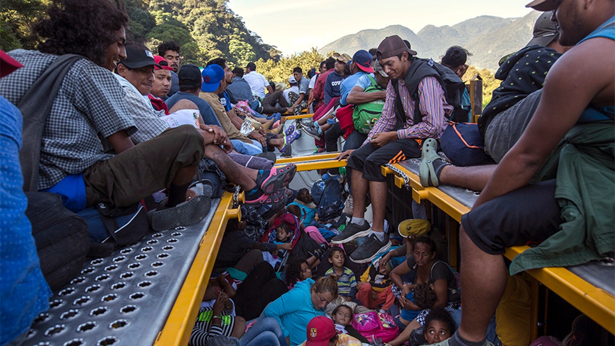 U.S.-bound Central American migrants riding on a truck that left Cordoba, Mexico.