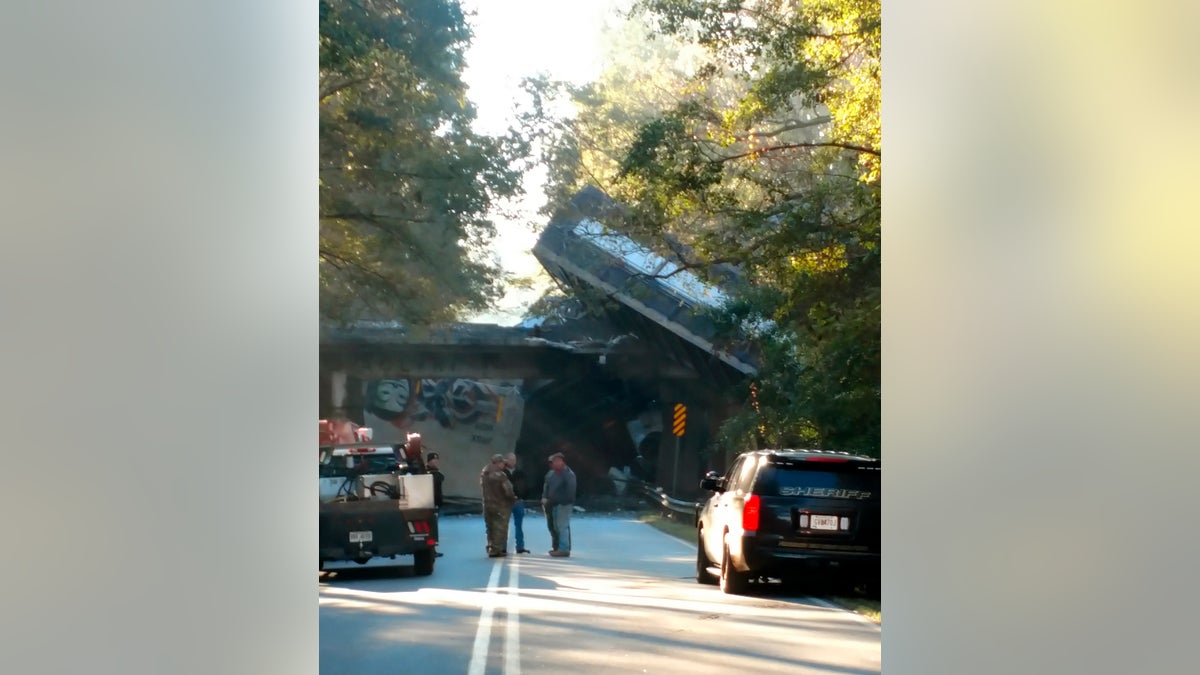 This photo provided by Stephanie Chapman shows emergency personnel working the scene of a train derailment on Saturday in Byromville, Ga.