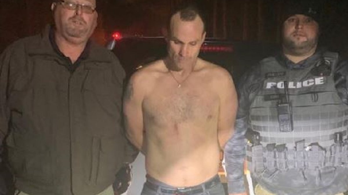 A South Carolina fugitive, center, was accused of striking an officer with a stolen vehicle.