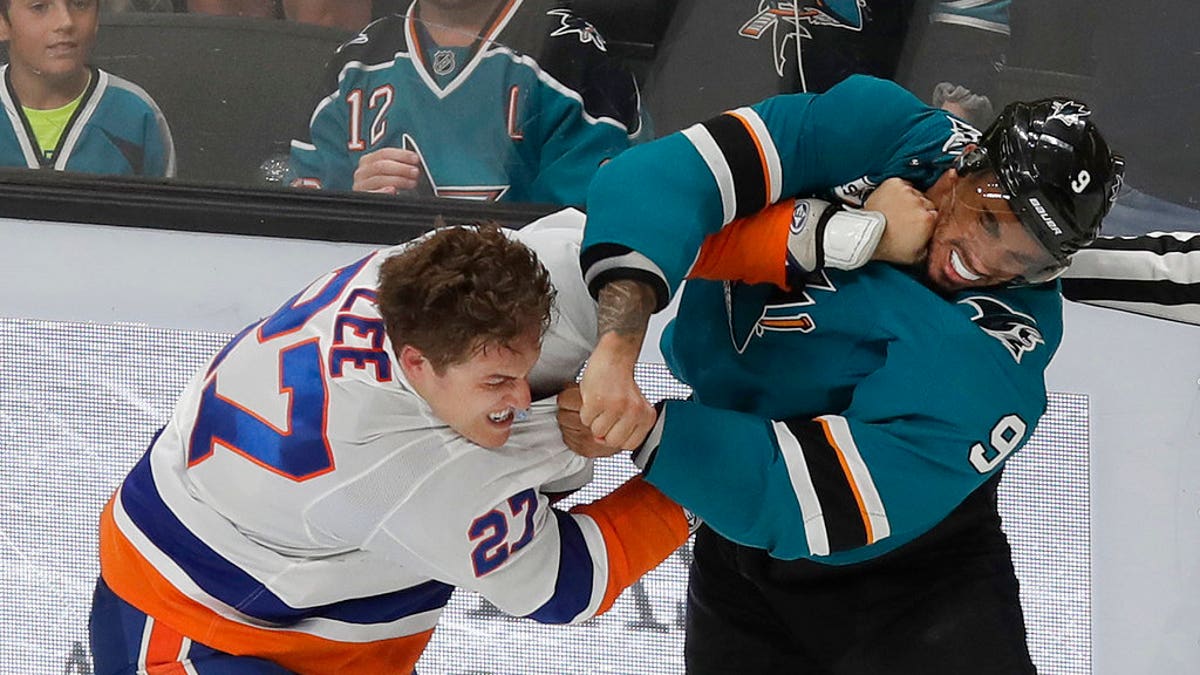 FILE: San Jose left wing Evander Kane, right, fights with New York Islanders left wing Anders Lee.
