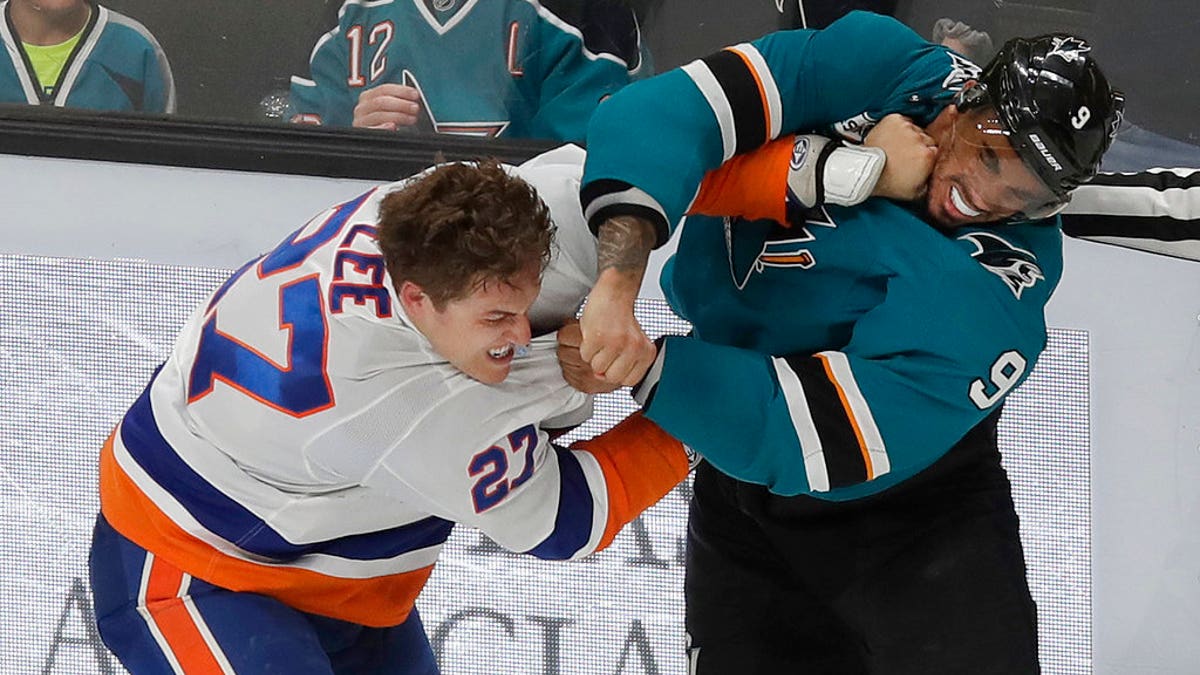 FILE: San Jose left wing Evander Kane, right, fights with New York Islanders left wing Anders Lee.